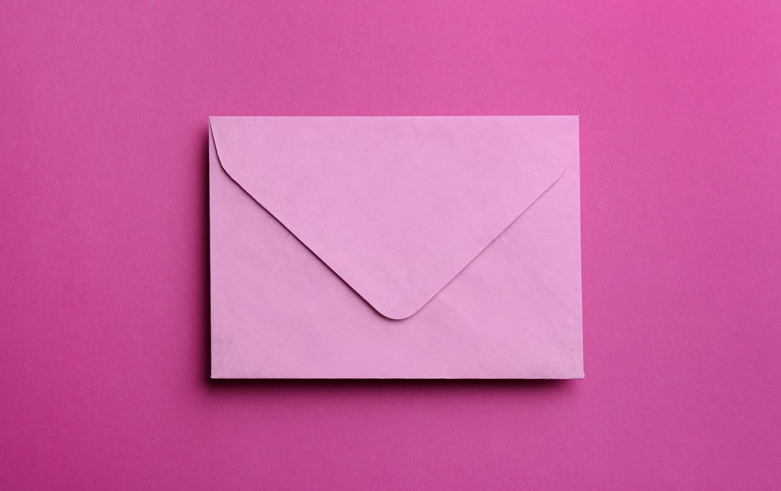 Pink Paper Envelope on Purple Background, Top View